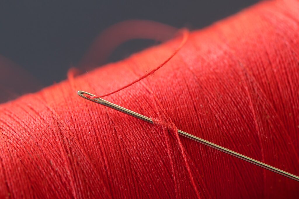 red thread, cotton thread, needle