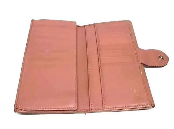 Pink Gucci wallet before the dye